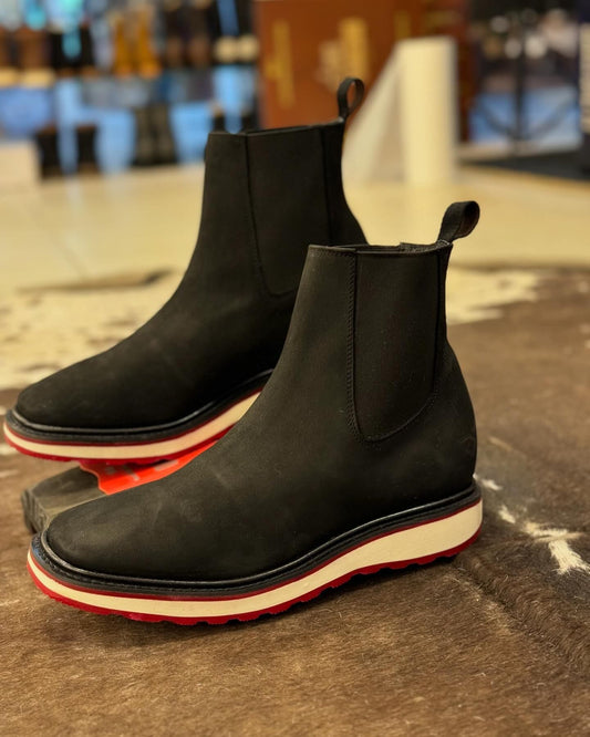 Black classic hand-made leather boots in the middle tube