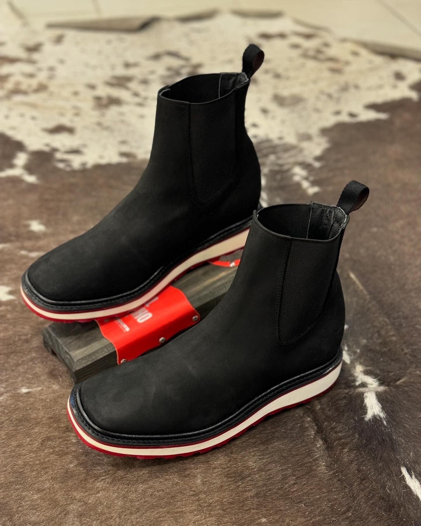 Black classic hand-made leather boots in the middle tube