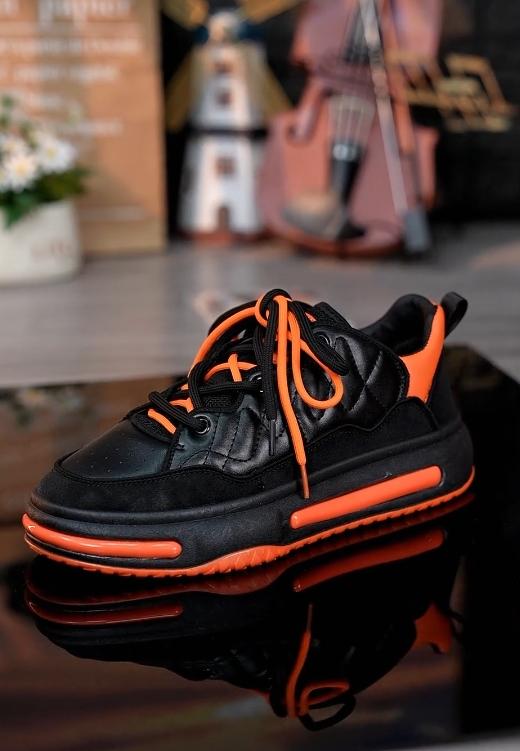 Black and orange stitching heightening casual shoes